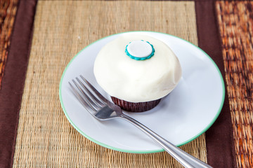 white sugar frost cupcake with fork