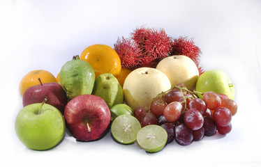 Variety of raw fruits isolated on white background