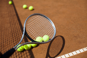 Tennis racket and balls, court