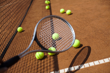 Tennis racket and balls, court