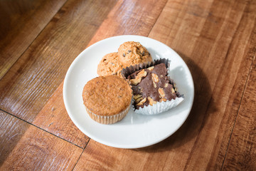 Fototapeta na wymiar Chocolate chips cookies and brownie on a white plate