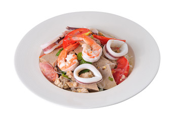 Spicy seafood noodles in white isolated