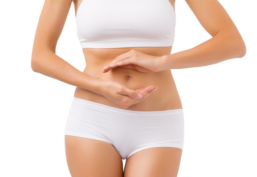 Healthy woman with hands around her stomach