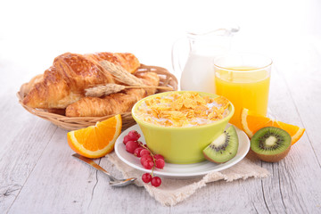 breakfast with cornflakes,croissant and fruits