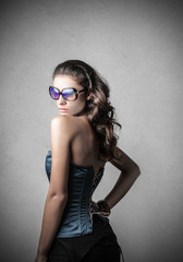 looking at herself in the mirror