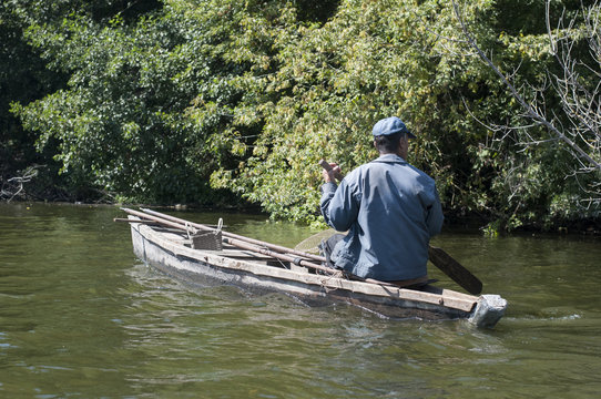 Fisherman Fishing On A Boat