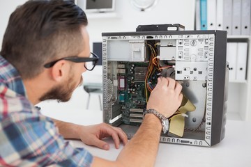 Fototapeta na wymiar Computer engineer working on broken console