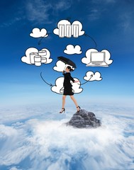 Composite image of young businesswoman holding umbrella