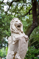 Fototapeta na wymiar Stone Lion Statue in Savannah Park