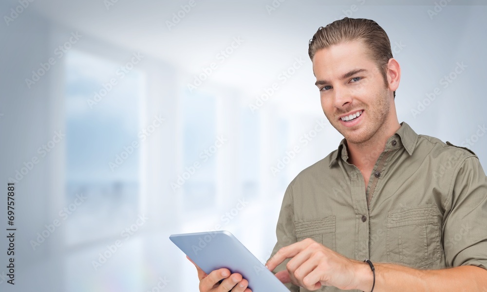 Poster composite image of happy man using tablet pc