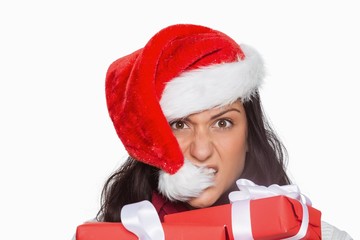 Irritated woman with christmas presents