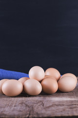 Chicken eggs on wooden background