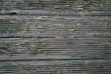 Cracked paint on a wooden wall. Wall from wooden planks with