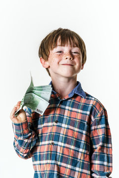 Happy red-haired boy with money