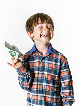 Happy red-haired boy with money