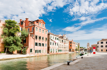 Small canal iwith colorful buildings n the Venice, Italy