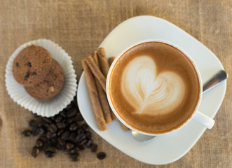 Cappuccino or latte coffee with heart shape