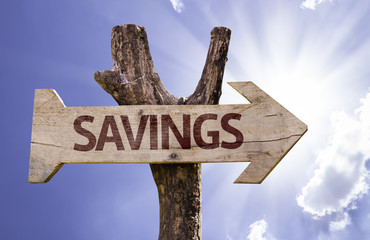 Savings wooden sign on a beautiful day