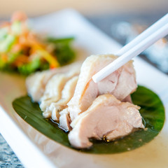Sliced chicken breast fillet on a cutting board
