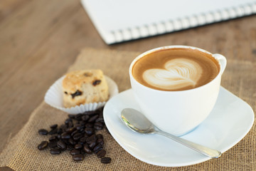 Cappuccino or latte coffee with heart shape