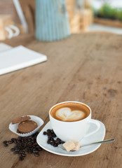 Cappuccino or latte coffee with heart shape