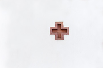 cross-shaped immersion in a white wall