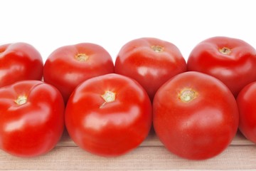Large tomatoes on the wooden board