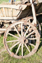 Fototapeta na wymiar Closeup of old wooden cart with wheel