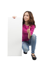 Woman showing an advertisement banner with thumb up