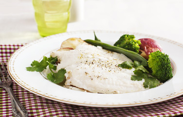 Baked fish fillet served with broccoli, green bean and potato