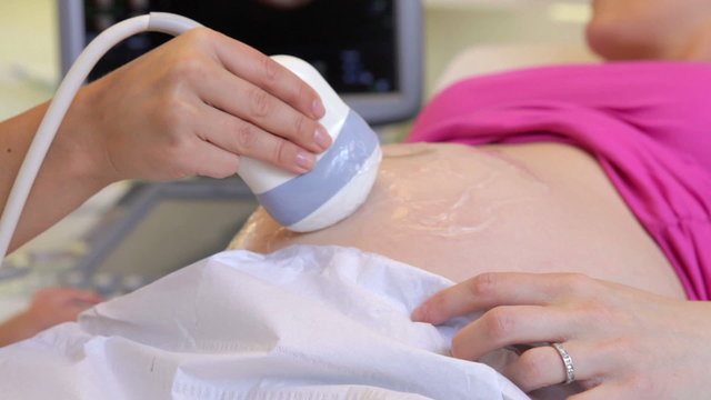 Close Up Of Pregnant Woman Having Ultrasound Scan