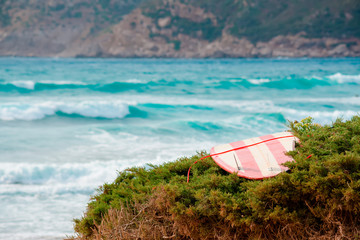 red and white surfboard