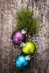 Christmas decoration ball on textured grungy wooden surface
