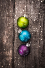 Christmas decoration ball on textured grungy wooden surface