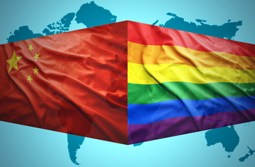 Waving Chinese and Gay flags