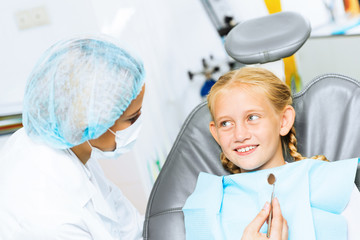 Dentist inspecting patient