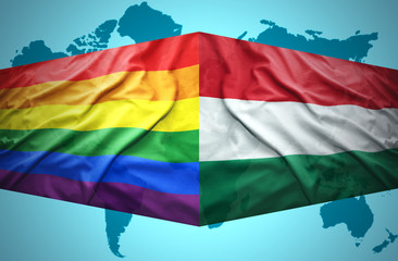 Waving Hungarian and Gay flags