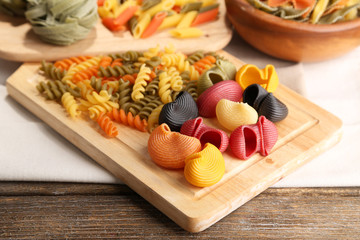 Colorful pasta on wooden background