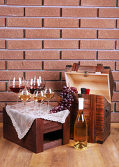 Bottle and glasses of wine and ripe grapes