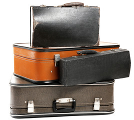 Vintage old travel suitcases, isolated on white