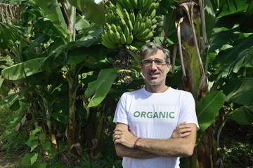 Organic farmer in front of banana plantation