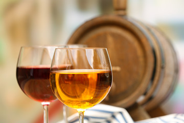 Red wine pouring into wine glass, close-up