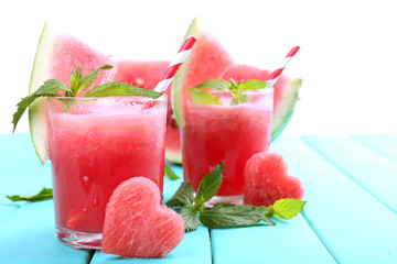 Watermelon cocktail on table, isolated on white