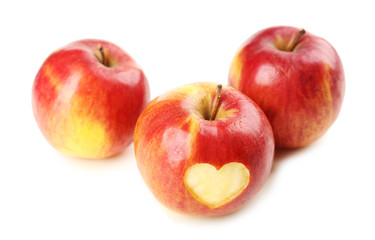 Red apple with heart isolated on white