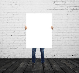 man holding blank placard