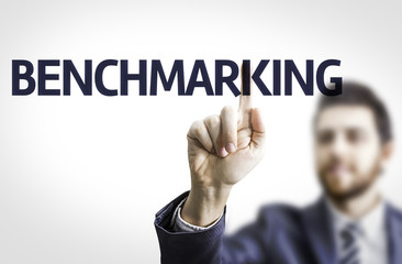 Business man pointing the text: Benchmarking