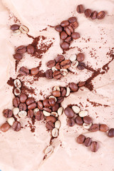 Coffee beans on piece of paper closeup