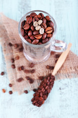 Glass and spoon with coffee beans