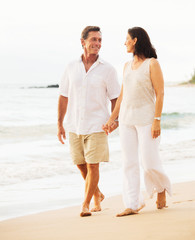 Mature Couple Enjoying Sunset on the Beach