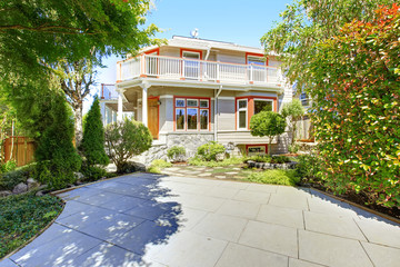 Fototapeta premium House with wrap-around walkout deck. Backyard view